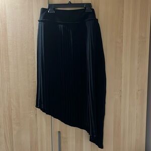 Pleated asymmetric black midi skirt